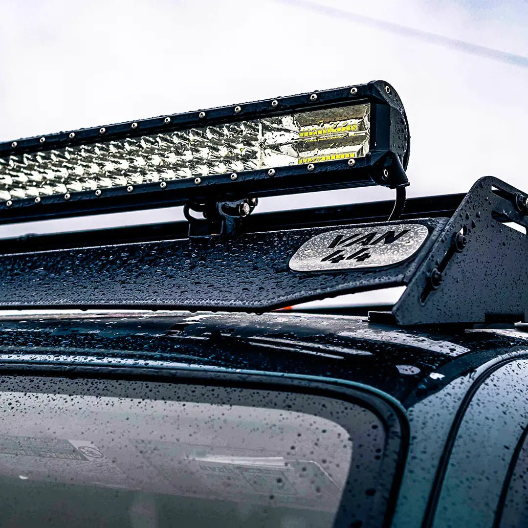 Detailed view of the roof rack with overlanding gear and light bar on a 4runner
