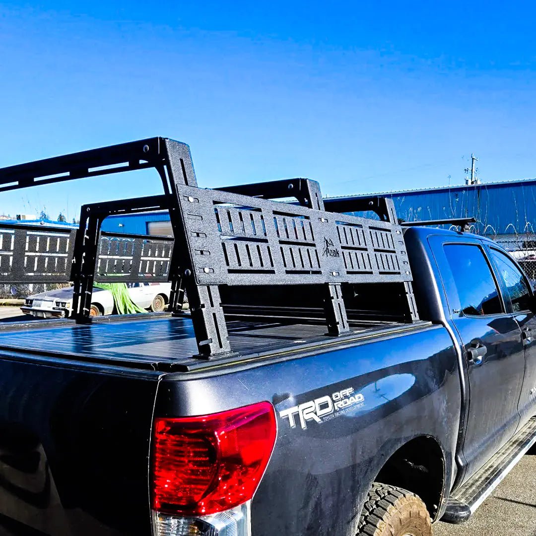 Rear view of the Adjustable Bed rack on a Toyota Tacoma with 3 crossbars