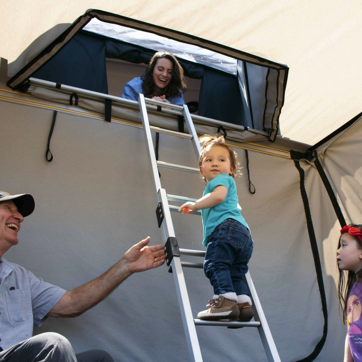 James Baroud Family Room on the ladder of the Rooftop tent