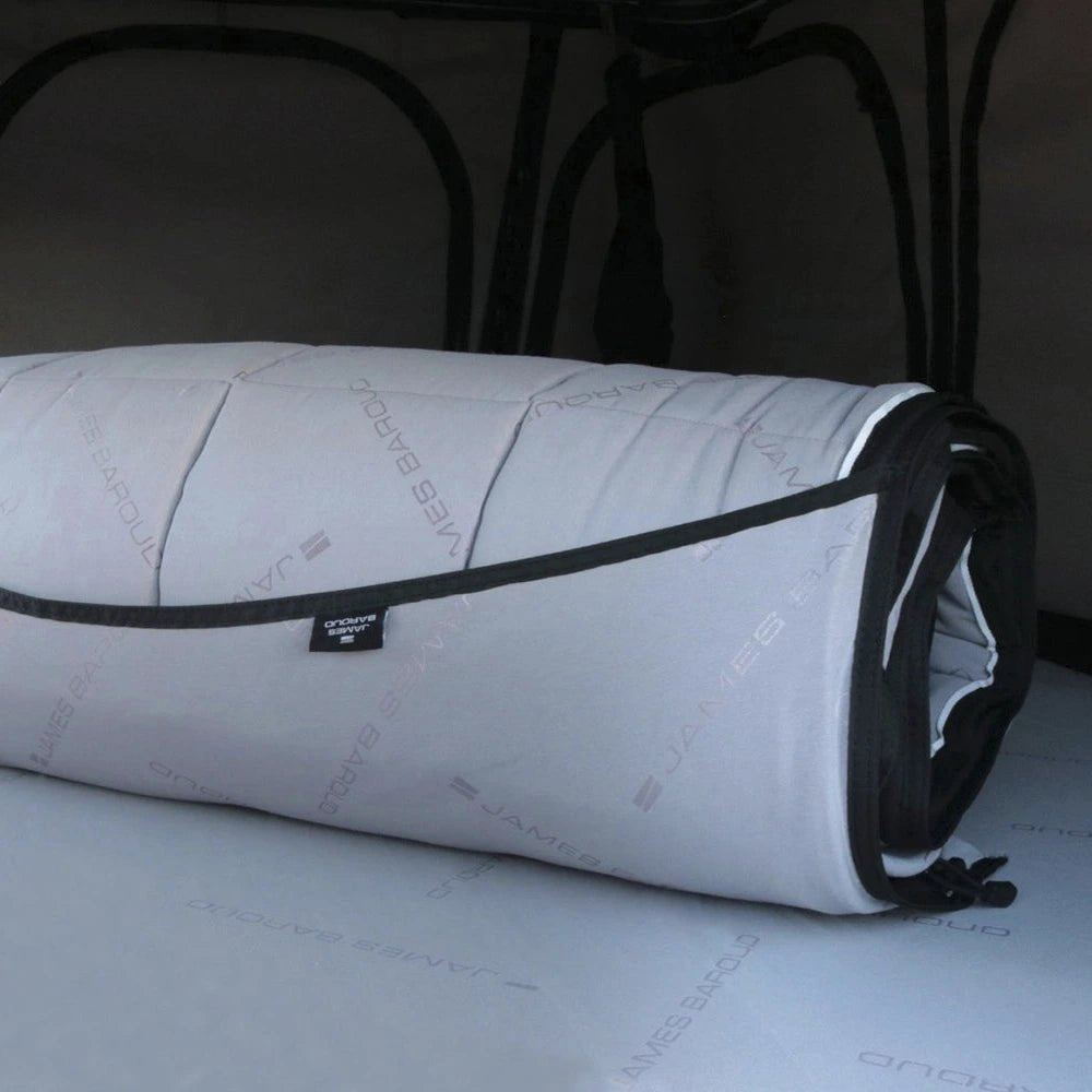 Rolled up bedding system for roof top tent