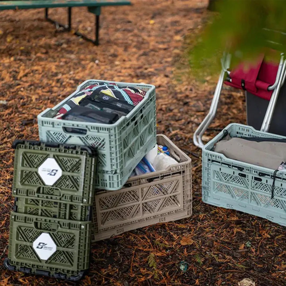 Crates in outdoor with clothes and camping stuff
