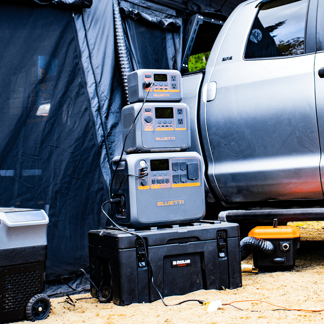 Bluetti Solar Generators on a Rugged Case with a roof top tent in camping