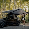 Self Standing Awning on a little car with a man under it