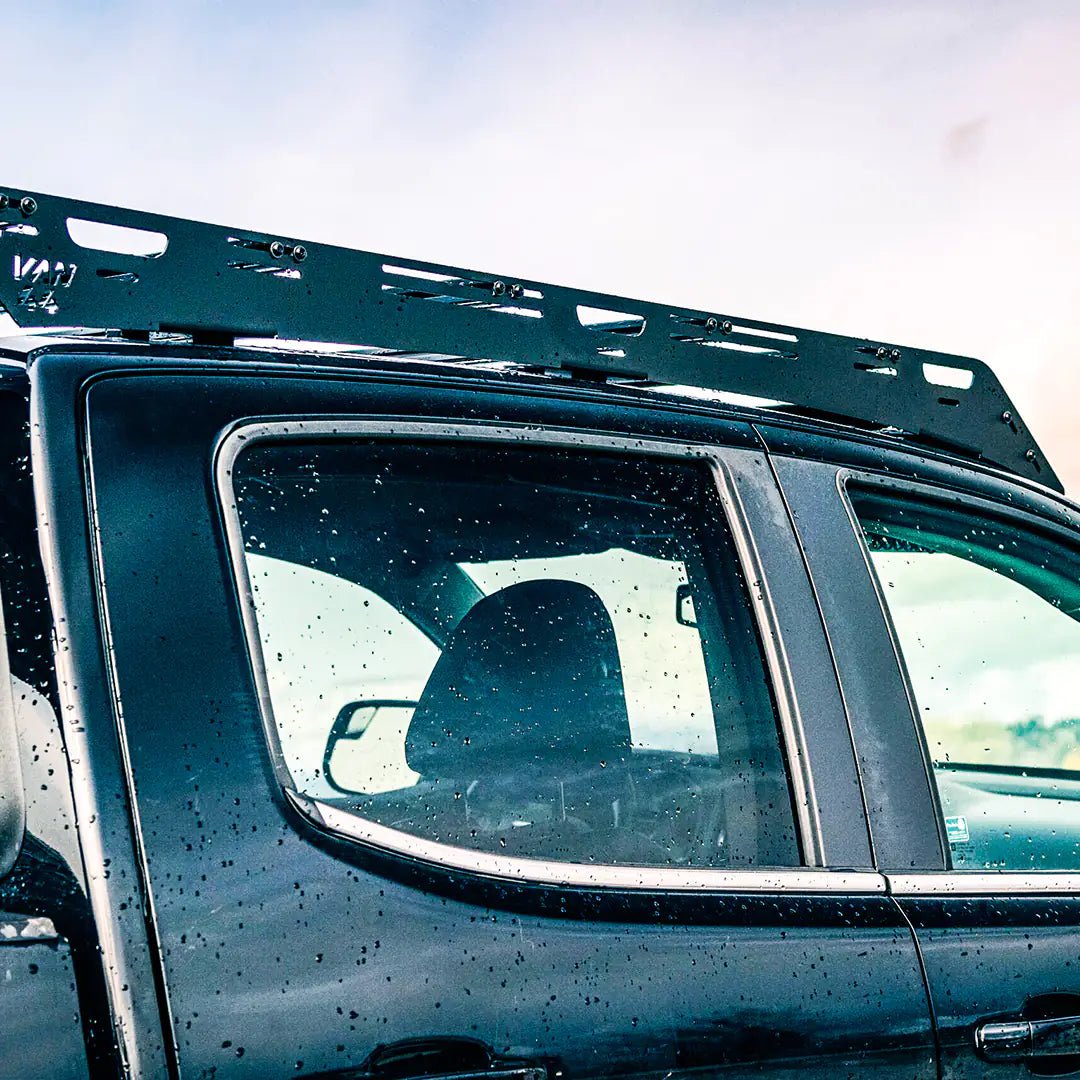 Side view of the roof rack cargo carrier for overland on this gmc canyon 2nd gen