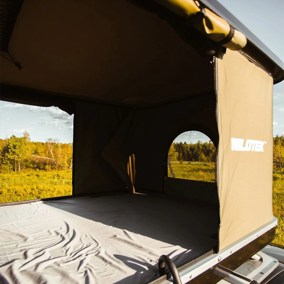 View of the inside of the pop up roof top tent by WildTek