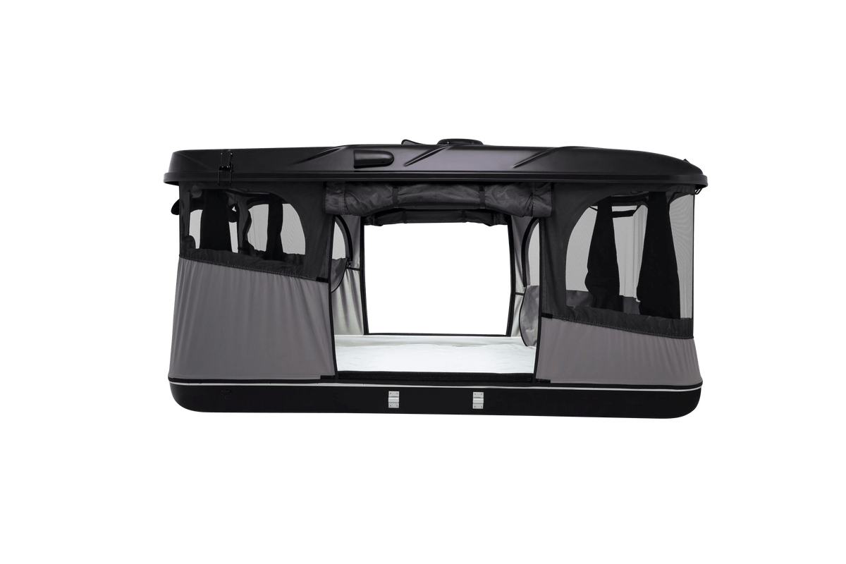 Side view of the black roof top tent with lights on and windows open