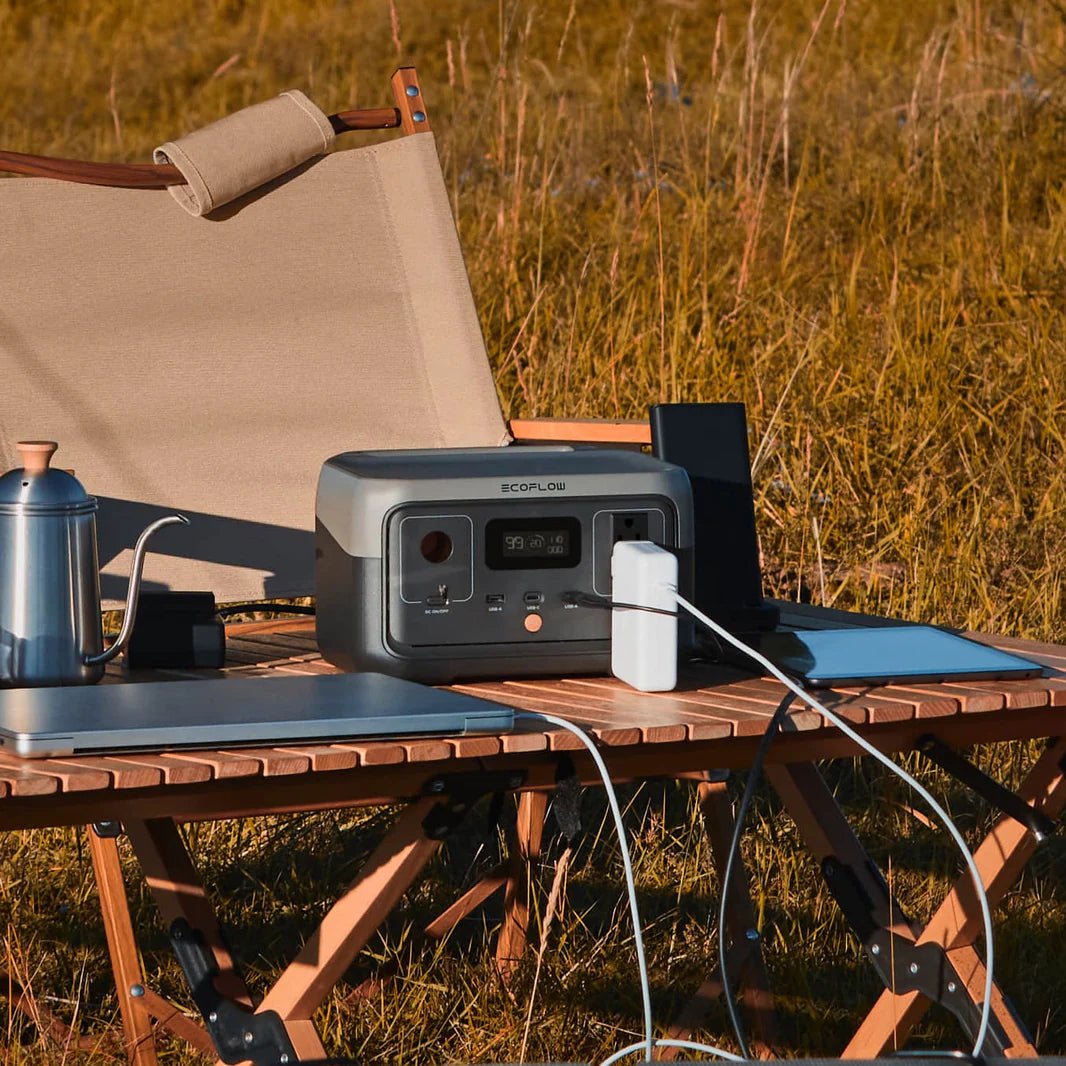 View of the power bank with ac outlet in camping with devices as laptop