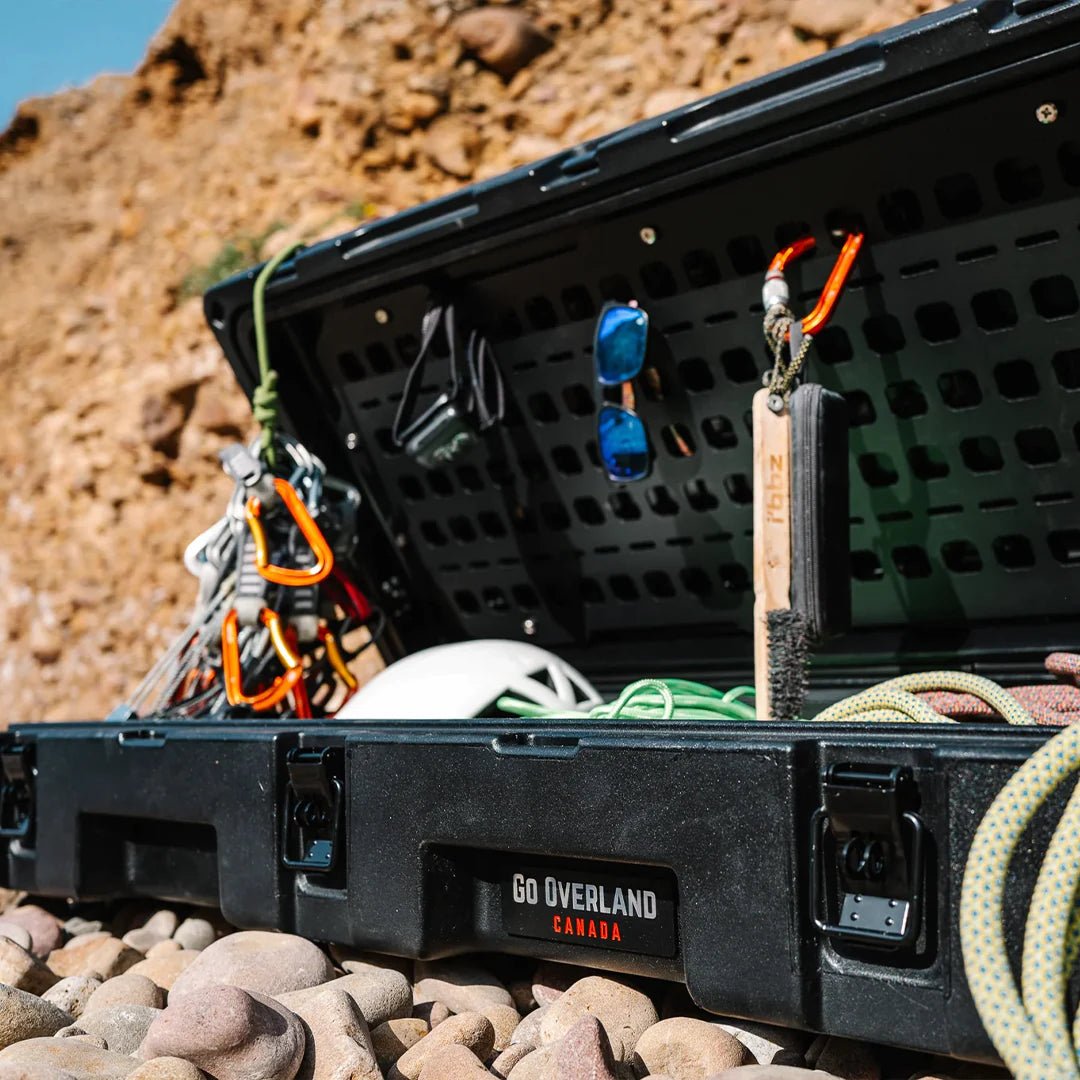 Opened case waterproof under the sun with overland stuff inside