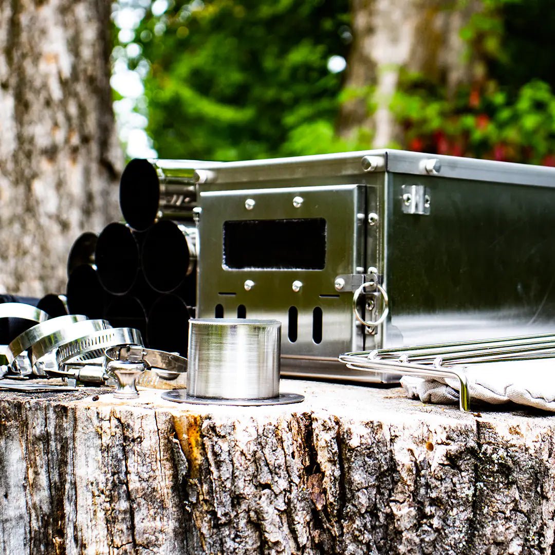 Large view of the tiny wood stove with pipes and parts